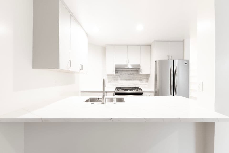 Remodeled kitchen with shaker cabinets and under-cabinet lighting